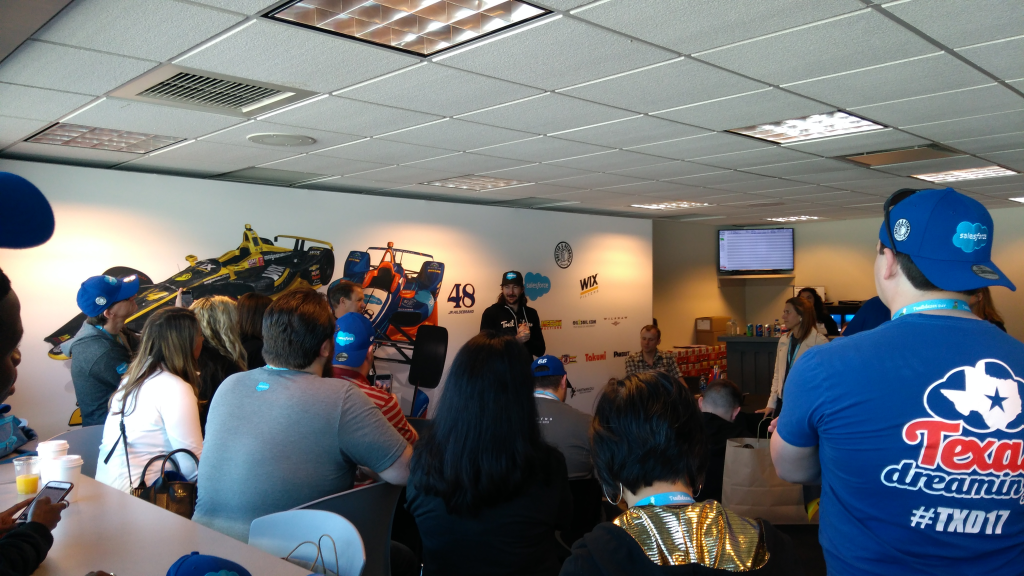 Picture of JR Hildebrand presenting, with various Trailblazers listening