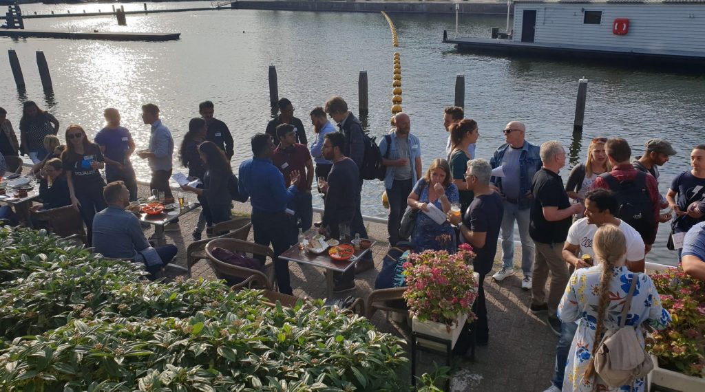 People networking alongside a canal