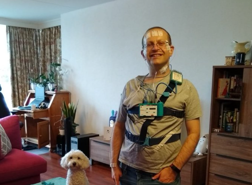 Paul, his dog Jessy, and a sleep monitor