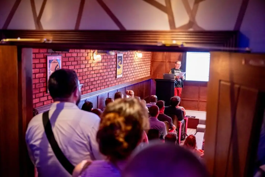 A picture of a conference room, from the photographer's perspective - the room was too busy for them to get in!
