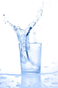 Picture of a glass of water, with the water splashing out