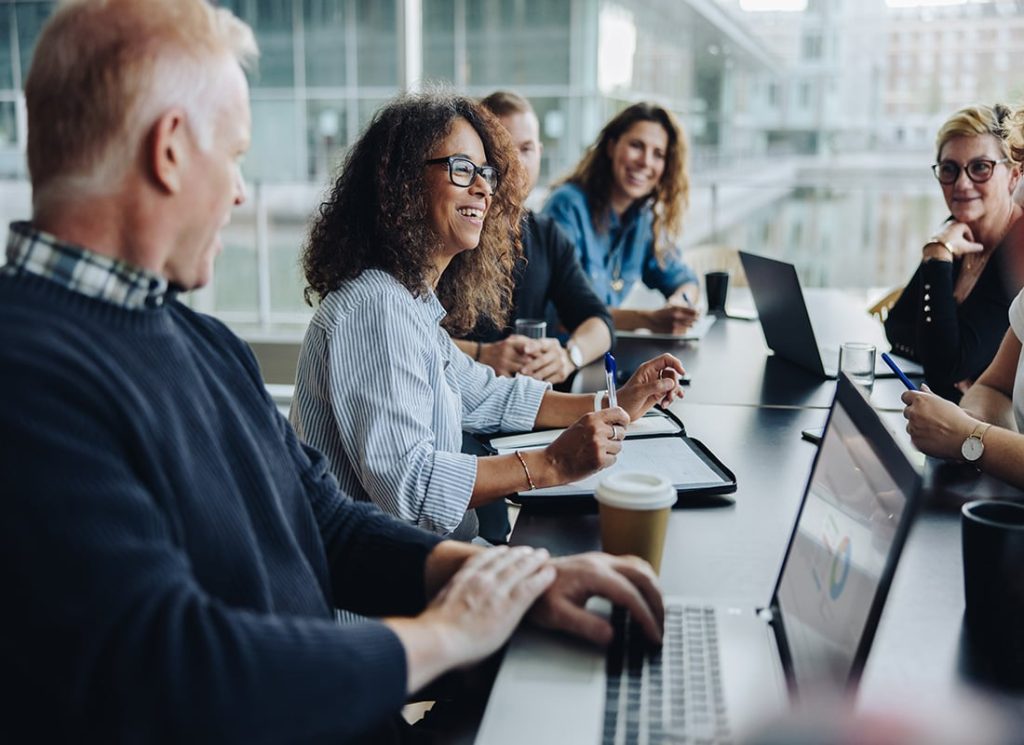 People working together in an office, listening to one another
