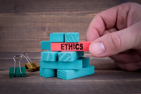 A set of jenga blocks, with one marked ethics